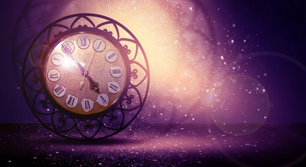 Clock vintage on an abstract background bokeh, neon, fulfillment of desires, magic of time