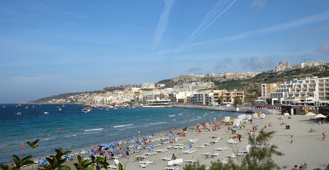 Mellieha Beach Malta And People View In Europe. Sunny day with blue sky.