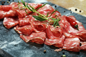 thinly sliced salami . delicious snack rustic salami