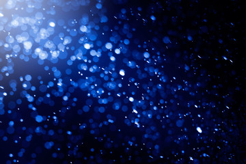 Abstract festive blue bokeh. .Defocused glitter lighting image in blue hexagon shape for background.