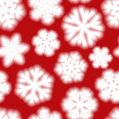 Christmas seamless pattern of big blurry snowflakes, white on red background