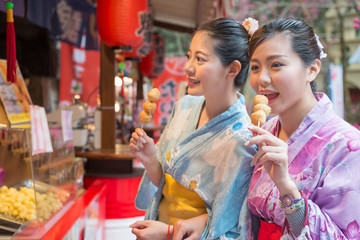 ladies eating the fried meat balls