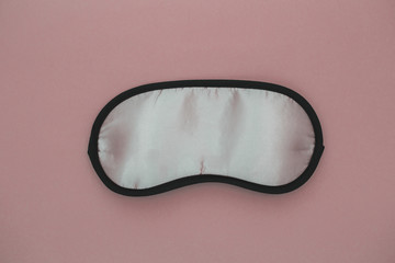 Fototapeta premium Sleeping eye mask, isolated on pink pastel colourful trendy background