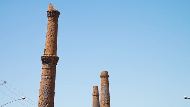 A scenic zoomed in shot of the tall minerets in Herat.