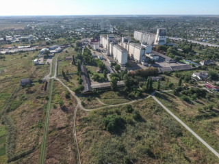 Top view of a silo elevator. The huge building for storing and drying grain. Aerophotographing industrial object.