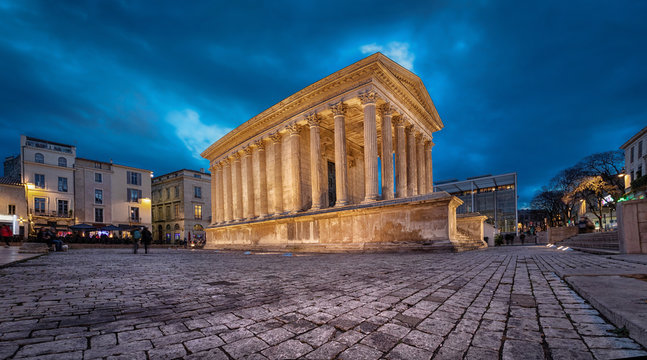Maison Carree - restored roman temple dedicated to 'princes of youth', with richly decorated columns & friezes in Nimes, France