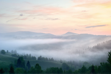 Foggy sunrise in the mountains