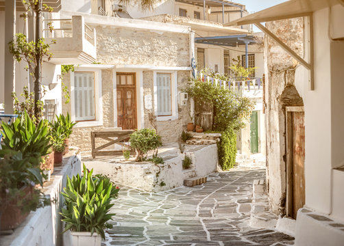 Fototapeta Narrow street with white houses, Greece