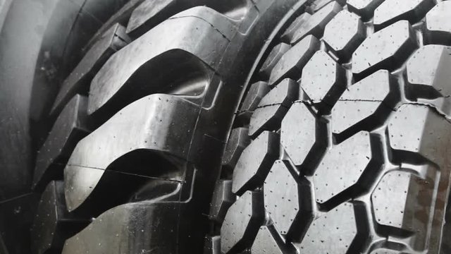 big tyre of a tractor or bulldozer. The details of the construction or repair of equipment