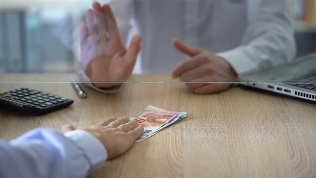 Bank worker refusing to exchange euro banknotes, counterfeit money, illegal deal