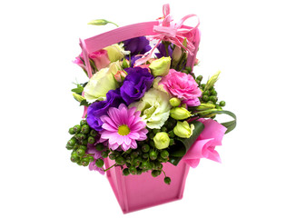 flower arrangement with roses, freesias in a pot on a white background
