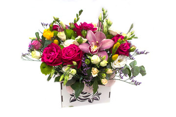 flower arrangement with roses, freesias in a pot on a white background
