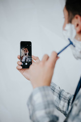 morning routine: a man shaving before going to work.