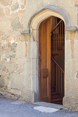 Fototapeta na wymiar Wooden door in an old stone castle