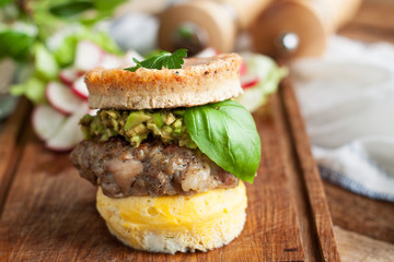 Homemade burger with eggs bun and guacamole