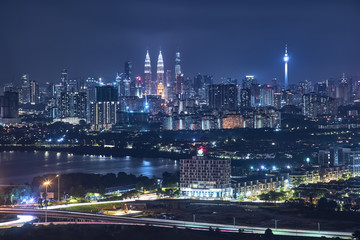 Fototapeta na wymiar Panorama .view in the middle of Kuala Lumpur cityscape skyline .Night scene , Malaysia .