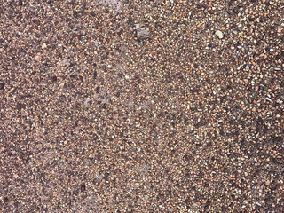 Detail of surface texture with small pebble .