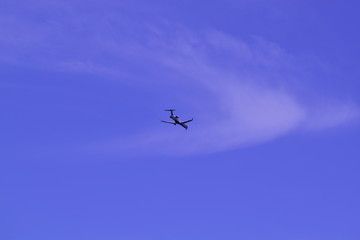 Naklejka na ściany i meble the airplane in the blue sky