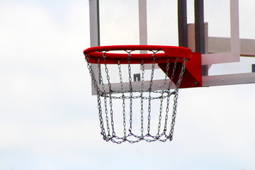 Basketball board on the sports field against the sky