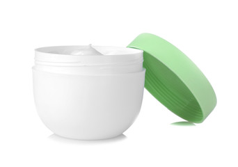 Face cream in a white jar with a green lid on a white background. isolated