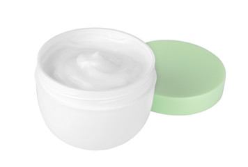 Face cream in a white jar with a green lid on a white background. isolated