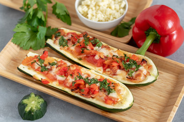 Grilled zucchini stuffed with vegetables and mozzarella cheese. Vegetarian food