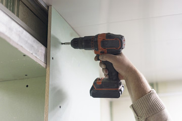 Plasterboard wall decoration repair, screwdriver