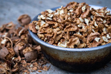 Walnuts kernels with color background, Whole walnut in a metal plate. Walnuts. Walnuts an market. Background of walnuts. Healthy.