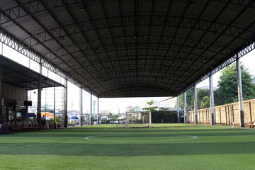 Fototapeta na wymiar Football field Small, Futsal ball field in the gym indoor, Soccer sport field outdoor park with artificial turf
