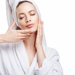 Young woman in a bathrobe and towel on her head, spa and care portrait, clean natural face,...
