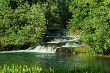 Fototapeta na wymiar Waterfall at Rastoke in Croatia in a sunny summer evening
