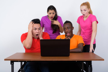Studio shot of diverse group of multi ethnic friends looking sho