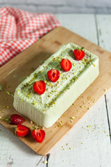 Pistachio ice cream with strawberries