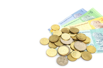 Malaysia Ringgit notes and coins on a white background.