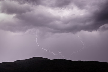 Naklejka na ściany i meble Allariz, Galicia / Spain - Jun 21 2018: lightning strike during a thunderstorm.