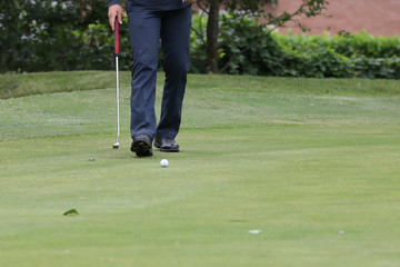 A golf player on a green
