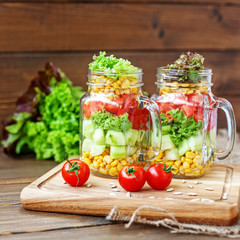 Vegetable salad, cherry tomatoes and sunflower seeds. Healthy fo