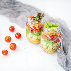 Vegetable salad with cucumbers, tomatoes and corn. Top view. Hea