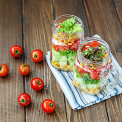 Vegetable is a useful delicious salad in glass jars. Healthy foo