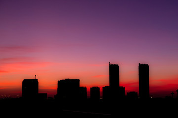 silhouette city at sunset sky