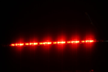 warning light car, brake light, hazard lights Night light effect background soft blurry on black...