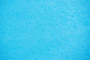 Fototapeta na wymiar Water with small waves and raindrops on a pool with blue texture background