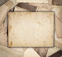 Vintage photo on heap old photos background
