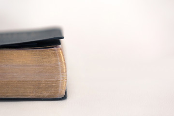 Holy Bible Pages Closeup on Light Background