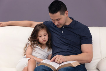 Father and Daughter Reading the Bible