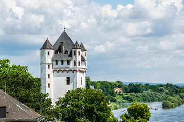 Fototapeta na wymiar A view on the Tower of the Castle from a higher Ground over Eltville on the Rosentage at the River Rhein in Rheinland-Pfalz in Germany