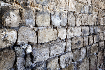 Old castle stone wall texture background in perspective