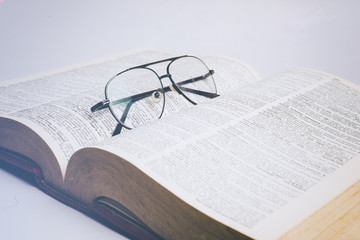 Glasses on open book 