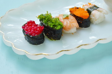 variety Sushi Japanese food with wasabi dipping soy sauce on white plate