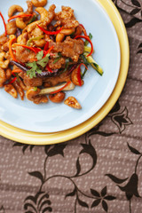 Stir fry chicken cashew nut with chili peppers and vegetable top view
